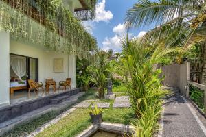 a villa with a garden and a house at Cahaya Ubud Villa in Ubud +118 photos