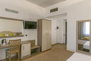 Postel nebo postele na pokoji v ubytování Hotel Boomerang Roma