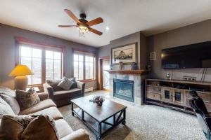 a living room with a couch and a fireplace at Main Street Station #1201 in Breckenridge