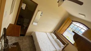 Postel nebo postele na pokoji v ubytování Brumas Ouro Preto Hostel e Pousada