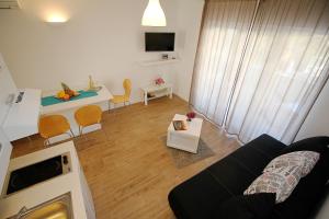 a living room with a couch and a table at Apartments Obitelj Vuletić in Makarska