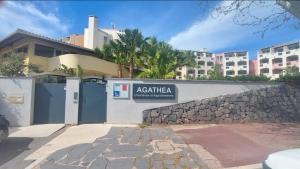 a building with a sign that readsactivate apartment therapy at Résidence Agathéa - Centre Port - Cap d'Agde in Cap d'Agde