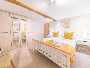a bedroom with a large bed and a desk at Lakeland View in Keswick