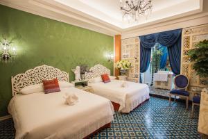 Ένα ή περισσότερα κρεβάτια σε δωμάτιο στο Anna King Hotel