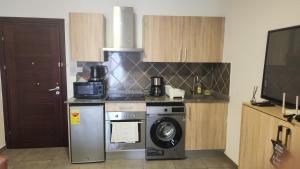 Kuchyň nebo kuchyňský kout v ubytování Oasis