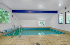 a swimming pool in a house at Holiday Home Møllevangen in Ovtrup
