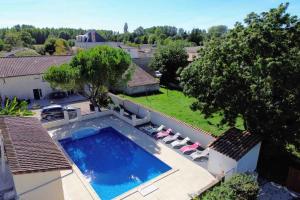 an overhead view of a swimming pool in a house at Gite La Bourdetaise pour 8 personnes in Le Bourdet