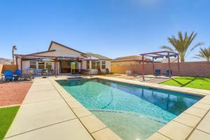 a swimming pool in front of a house at Pool, Spa and More Relax in Desert Hot Springs! in Desert Hot Springs