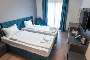 Postel nebo postele na pokoji v ubytování Hotel Diamond