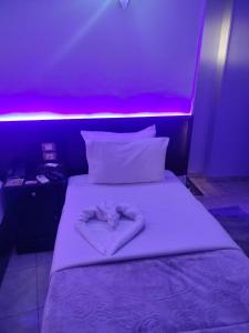 Letto o letti in una camera di Abo Elwafa Hotel