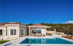 a house with a swimming pool and a patio at Villa Katarina Diklo in Zadar