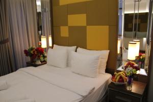 Postel nebo postele na pokoji v ubytování The Biancho Hotel Pera