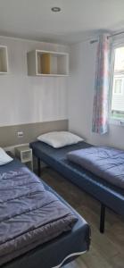Postel nebo postele na pokoji v ubytování Mobil-home confort 6 personnes proche Europa-Park