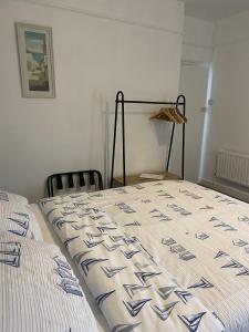 a bedroom with two beds with a quilt on them at The Rosefield in Weymouth +17 photos
