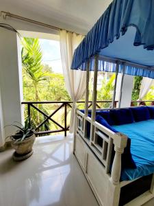 Ένα ή περισσότερα κρεβάτια σε δωμάτιο στο Green Malindi Apartments by RevSerene +23 φωτογραφίες