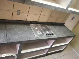a kitchen counter with a sink on a shelf at Casa Cartagena in Zamora de Hidalgo