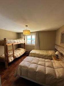 Postel nebo postele na pokoji v ubytování Bariloche Hostel
