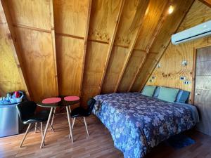 Voodi või voodid majutusasutuse A-FRAME CABIN PUCON toas