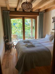 Posteľ alebo postele v izbe v ubytovaní Lake House I // Alauzet Ecolodge + Nature spa