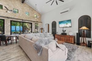 a living room with a couch and a table at Luxurious 3 Bedroom Villa in Coco +28 photos