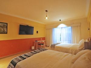 Postelja oz. postelje v sobi nastanitve Hotel Boutique Típico