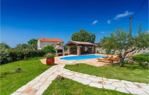 a backyard with a swimming pool and a house at Villa Marco in Rovinj