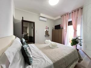 Giường trong phòng chung tại Holiday House Via Vicenza 25