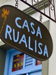 a sign that reads casa rubia in front of a building at Casa Rualisa in Belmonte