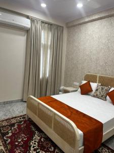 Ένα ή περισσότερα κρεβάτια σε δωμάτιο στο The Little Experience, Jaipur