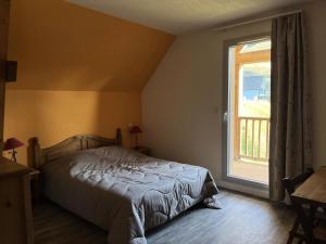 Posteľ alebo postele v izbe v ubytovaní Résidence Hameau De Balestas Mp - T3/6pers CHEVECHE 04-Peyresourde MAE-9554