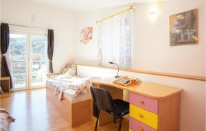 a bedroom with a desk and a bed and a desk and a desk at Cozy Home In Neoric With House A Panoramic View in Neorić