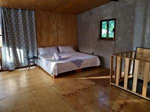 Postel nebo postele na pokoji v ubytování Cabaña de Grangelo