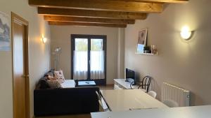 a living room with a couch and a table at Apartamentos Panticosa in Panticosa
