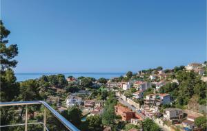a town on a hill with houses and the ocean at Lovely Home In Santa Susanna With Wifi in Santa Susanna