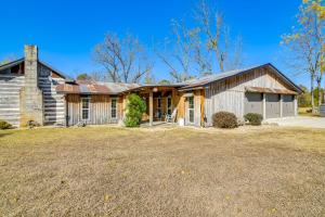 an old house with a large yard in front of it at half-Mi to Lake Cabin on 43 Acres in Shell Knob! in Shell Knob
