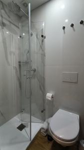 Koupelna v ubytování DOMI Suites & Studios