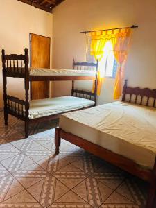 Ένα ή περισσότερα κρεβάτια σε δωμάτιο στο Chacara Sr Antonio dos Reis (Piaui)