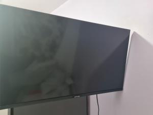 a flat screen tv sitting on top of a table at Guesthouse in Tilbury