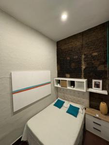 Ένα ή περισσότερα κρεβάτια σε δωμάτιο στο Moonshine Boutique Hostal