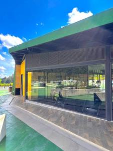 a building with a tennis court inside of it at NEW Apt WiFi Sauna Gym at Medellin in Rionegro