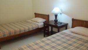 Postel nebo postele na pokoji v ubytování Lovina Beach Hotel