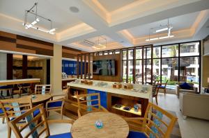 ห้องอาหารหรือที่รับประทานอาหารของ Henann Lagoon Resort