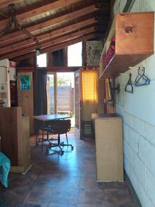 a kitchen with a table and chairs in a room at CasaEstudio 41 esq 24 in Miramar