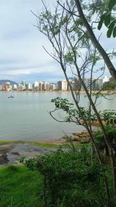 a view of a body of water with a city at Colonial Praiano in Guarapari