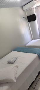 Postel nebo postele na pokoji v ubytování Hotel Andorinha