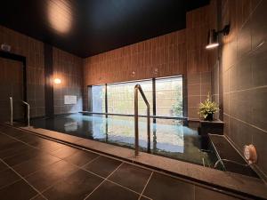 Bazén v ubytování Hotel Route Inn Rifu nebo v jeho okolí