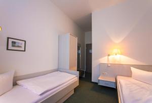Кровать или кровати в номере Hotel Weide