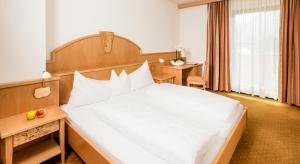 Voodi või voodid majutusasutuse Garni Hotel Am Meilenstein toas