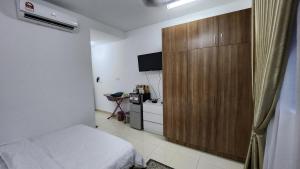 TV a/nebo společenská místnost v ubytování EnL Homestay ALANIS Residence