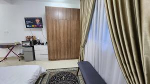 Postel nebo postele na pokoji v ubytování EnL Homestay ALANIS Residence
